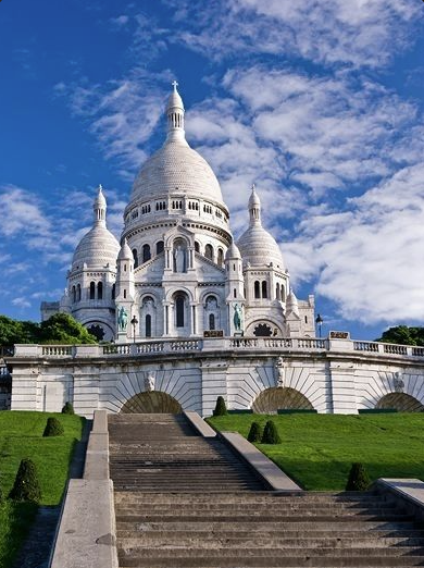 Sacré-Cœur Basilica in Montmartre, Paris showing elevated views and domed geometry - best photographed during sunset blue hour